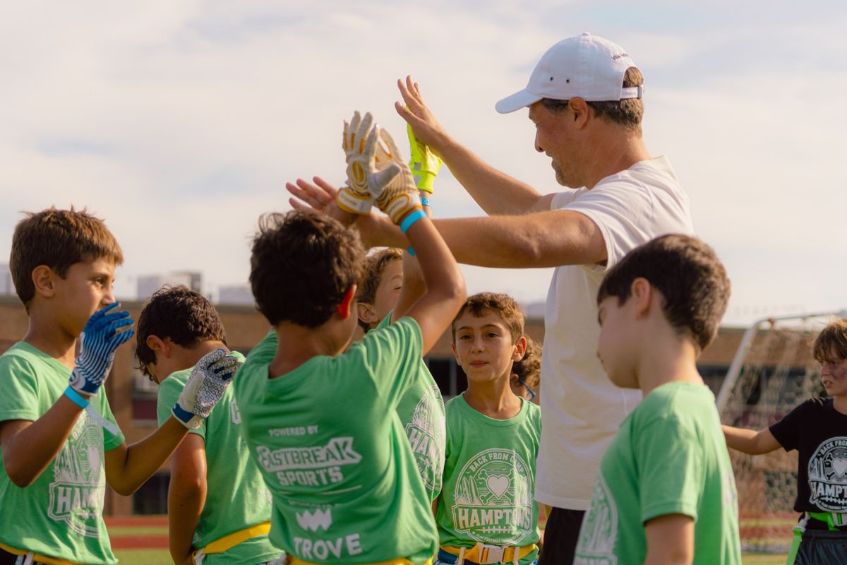 Coach high-fives his players