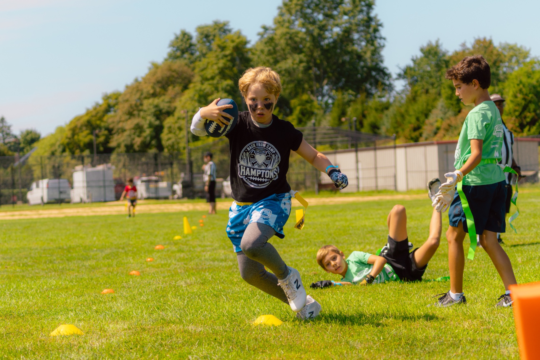 ALL HEART player running with the ball