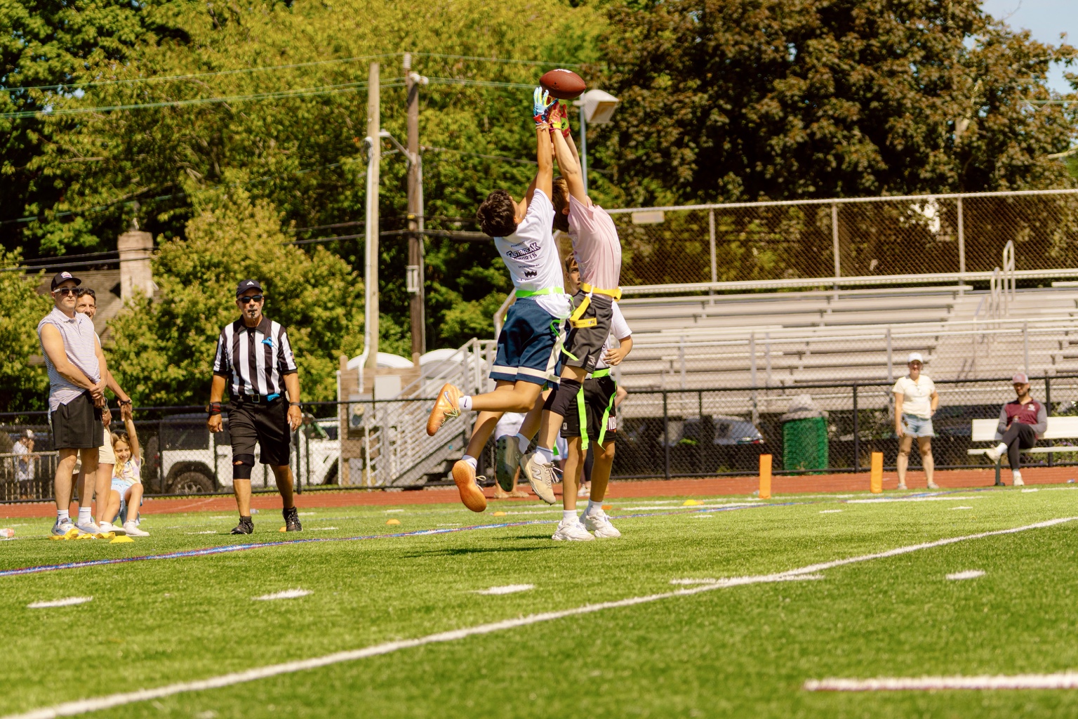 Two ALL HEART players leaping for a catch